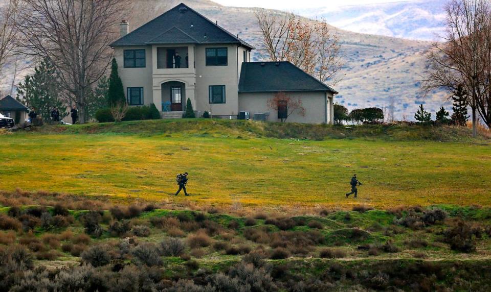 Members of the Tri-Cities Regional SWAT team move toward a ravine where Kennewick murder suspect Adam P. Klei was hiding. Bob Brawdy/bbrawdy@tricityherald.com