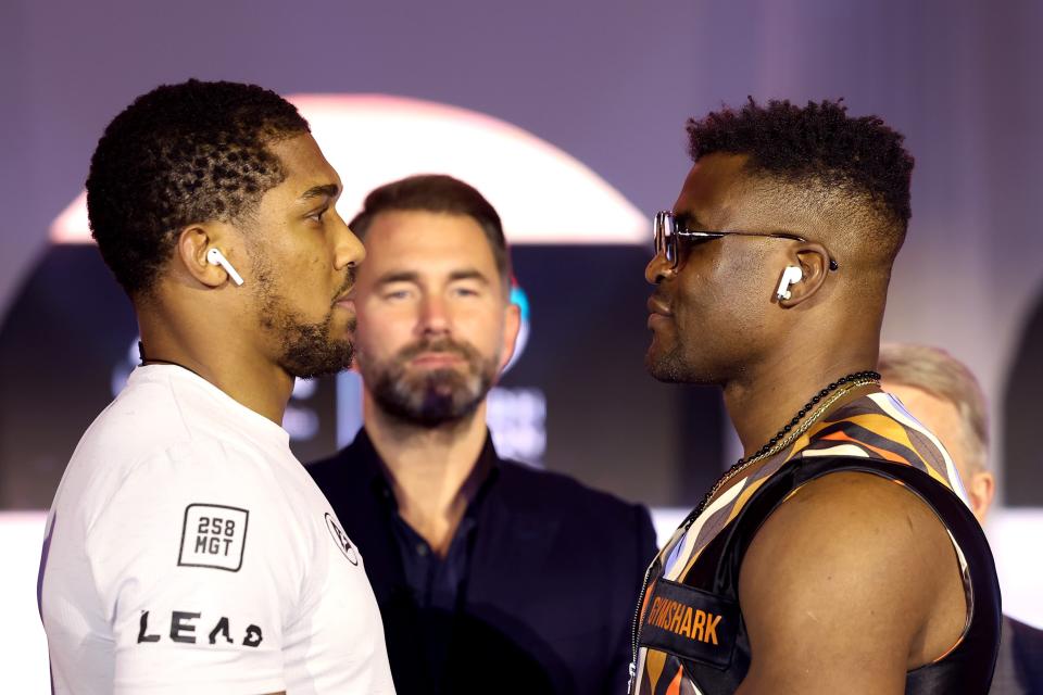 Anthony Joshua (left) faces off with Francis Ngannou ahead of Friday’s fight (Getty Images)