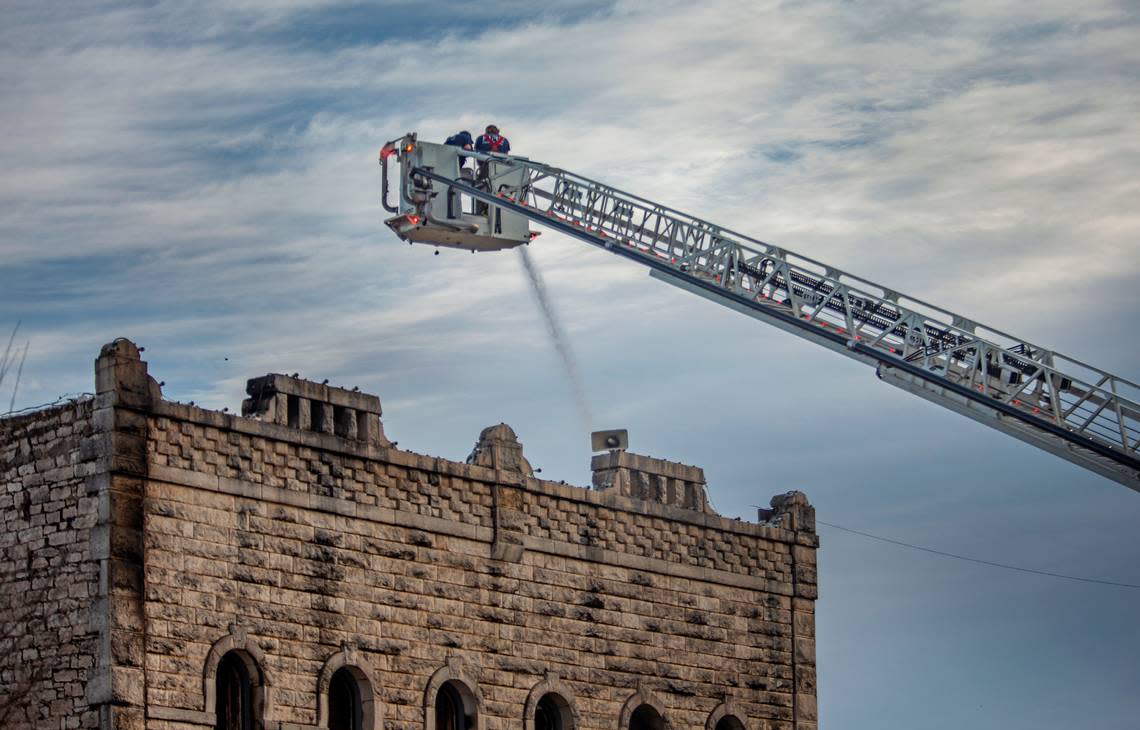 A crew from the Granbury Volunteer Fire Department spray the second floor of the historic Nutt House Hotel in Granbury with water. Firefighters responded to a call shortly after 1 a.m. Thursday morning, March 3, 2023. Cause of the fire is still under investigation. 