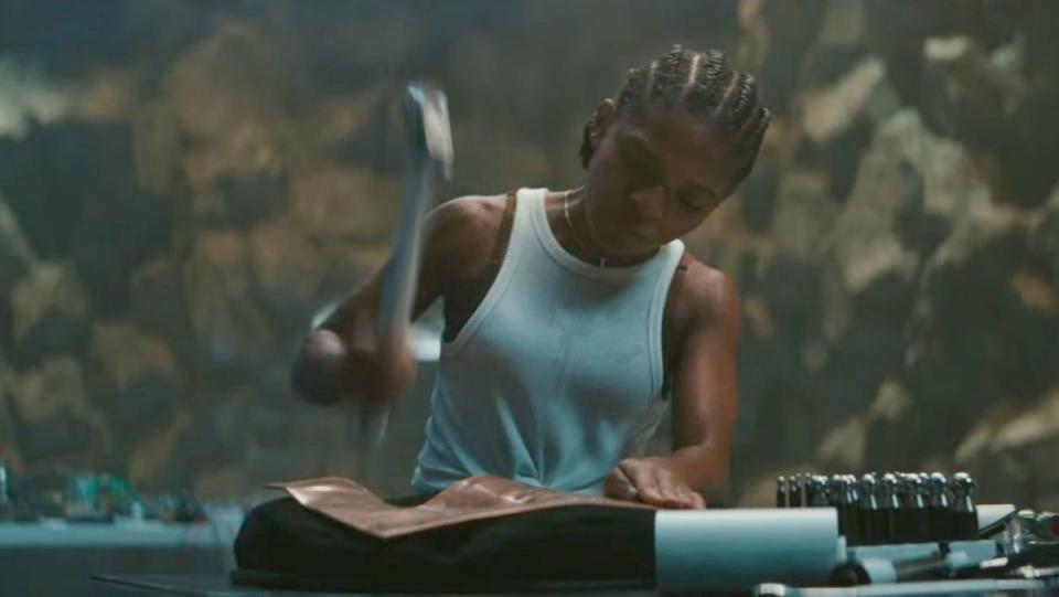 dominique thorne as riri ironheart williams makes a metal suit in black panther wakanda forever trailer