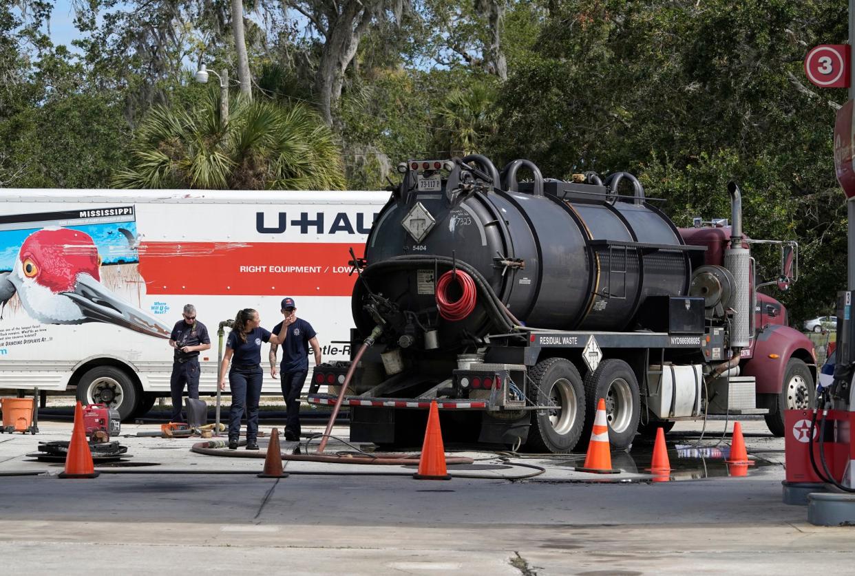 New Smyrna Beach Fire Department officials investigate an incident where a fuel tanker reportedly caught fire at the Banana/Texaco gas station in New Smyrna Beach, Monday, Oct. 24, 2022.