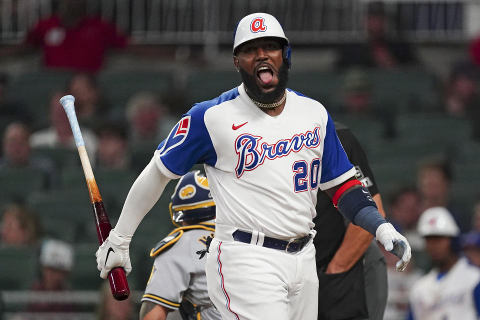 Atlanta Braves' Marcell Ozuna reacts after foul-tipping a pitch in the seventh inning of a baseball game against the Milwaukee Brewers, Friday, May 6, 2022, in Atlanta. (AP Photo/John Bazemore)