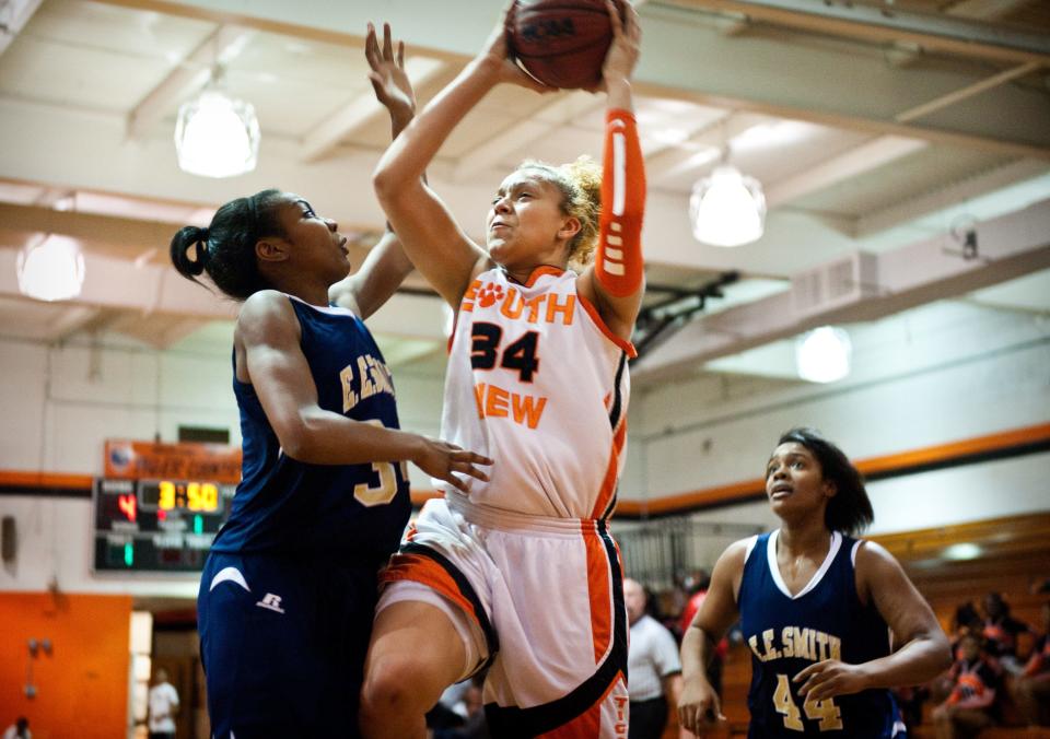 South View's Sidney Cook goes for a lay up in front of E.E. Smith's Kristen McMillian during the first quarter of Friday night's game at South View High School in 2012.