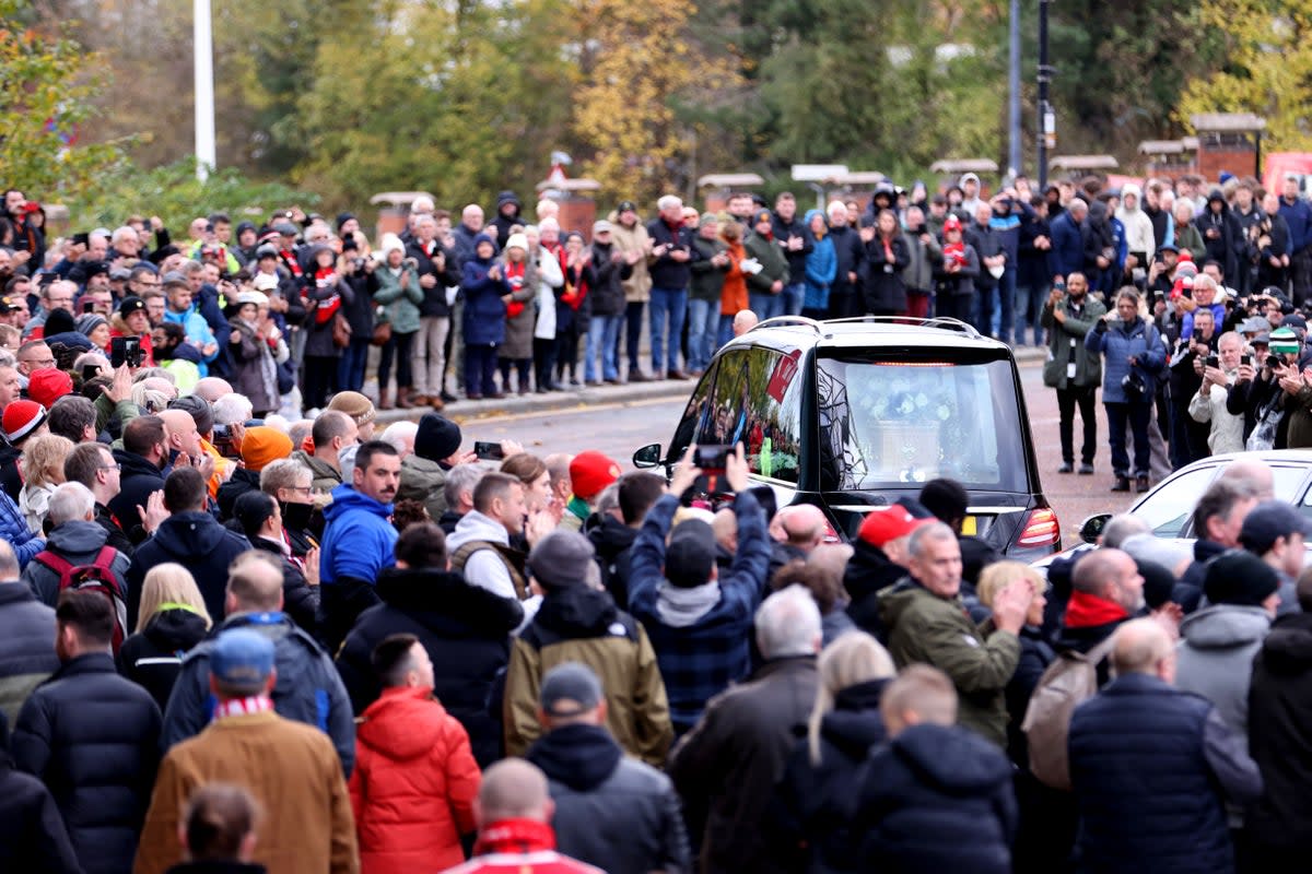 The funeral procession goes past Old Trafford. (Getty Images)