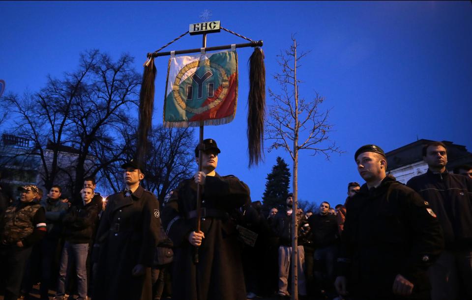 Bulgarian far-right nationalists gather near Alexander Nevsky cathedral in Sofia, Saturday, Feb. 15 2014. Hundreds of Bulgarian nationalists have marched through the capital to honor a World War II general known for his anti-Semitic and pro-Nazi activities, although Sofia's mayor had banned Saturday's rally, organized by the far-right Bulgarian National Union.(AP Photo/Valentina Petrova)