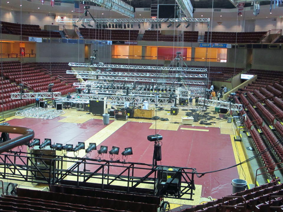 In this Wednesday, May 15, 2013 photo, crews from the Spoleto Festival USA transform the TD Arena at the College of Charleston in Charleston, S.C., into a performing space for the festival. The arena is needed because a longtime Spoleto venue is being renovated. The 37th season of the internationally known arts festival opens on Friday, May, 24, 2013. (AP Photo/Bruce Smith)