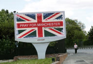 <p>A man walks past a sign in Manchester, Britain on May 23, 2017. (Stefan Wermuth/Reuters) </p>