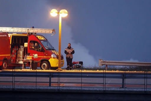 Fire vehicles are parked within the Penly nuclear power plant, after a nuclear reactor shut down automatically following a fire alert. Radioactive cooling fluid leaked at a French nuclear reactor Thursday following two small fires, but the spillage was safely collected in special tanks, officials said