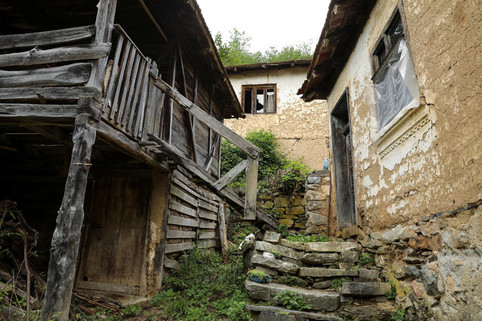 <p>Abandoned houses stand in the empty village of Repusnica, near the southeastern town of Knjazevac, Serbia, Aug. 14, 2017. (Photo: Marko Djurica/Reuters) </p>