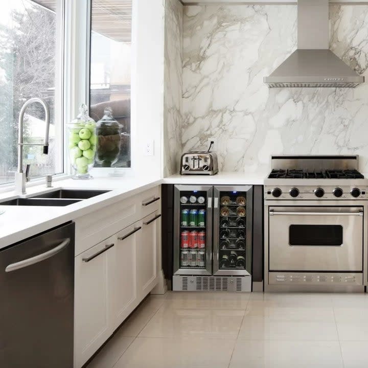 the wine and beverage fridge shown completely full 