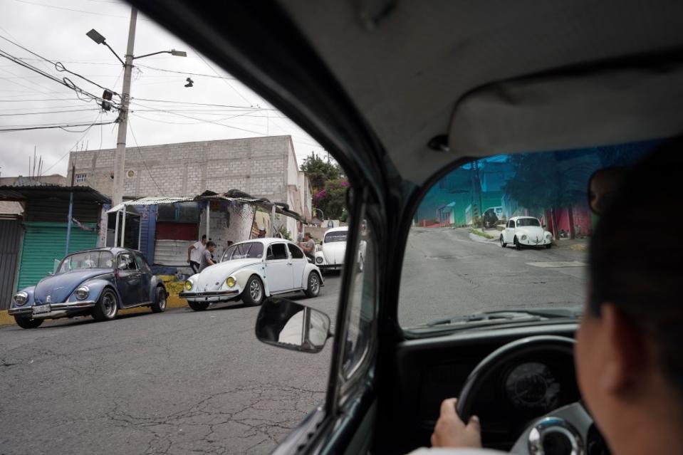 The “vochos” are known as the people’s car because they are inexpensive and the rear engine gives them the power to ascend the hilly neighborhood. AP