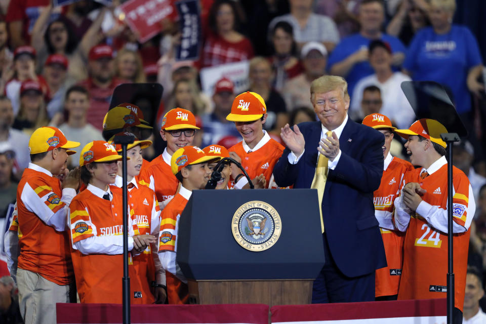 President Donald Trump introduces the reigning Little League World Series championship team from River Ridge, La., during his campaign rally in Lake Charles, La., Friday, Oct. 11, 2019. The team visited the White House earlier in the day, and the President flew them back to Louisiana on Air Force One. (AP Photo/Gerald Herbert)