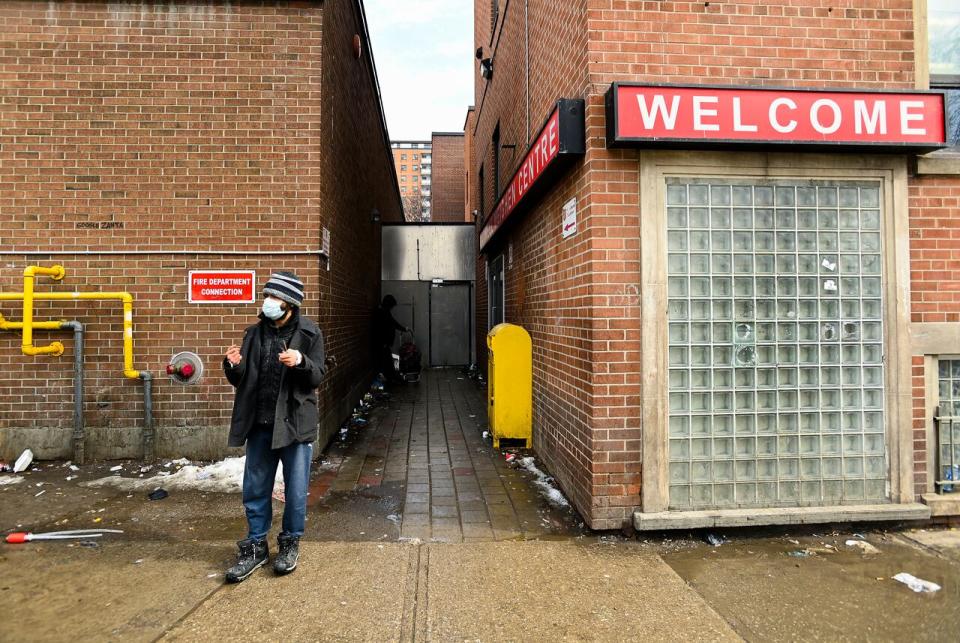 A homeless man walks outside the Maxwell Meighen Centre as the new COVID-19 variants have spread among homeless populations in a and around the city during the COVID-19 pandemic in Toronto on Wednesday, February 24, 2021. 