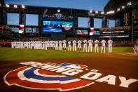 Mar 29, 2018; Phoenix, AZ, USA; Arizona Diamondbacks players line the field prior to the game against the Colorado Rockies during Opening Day at Chase Field. Mandatory Credit: Mark J. Rebilas-USA TODAY Sports