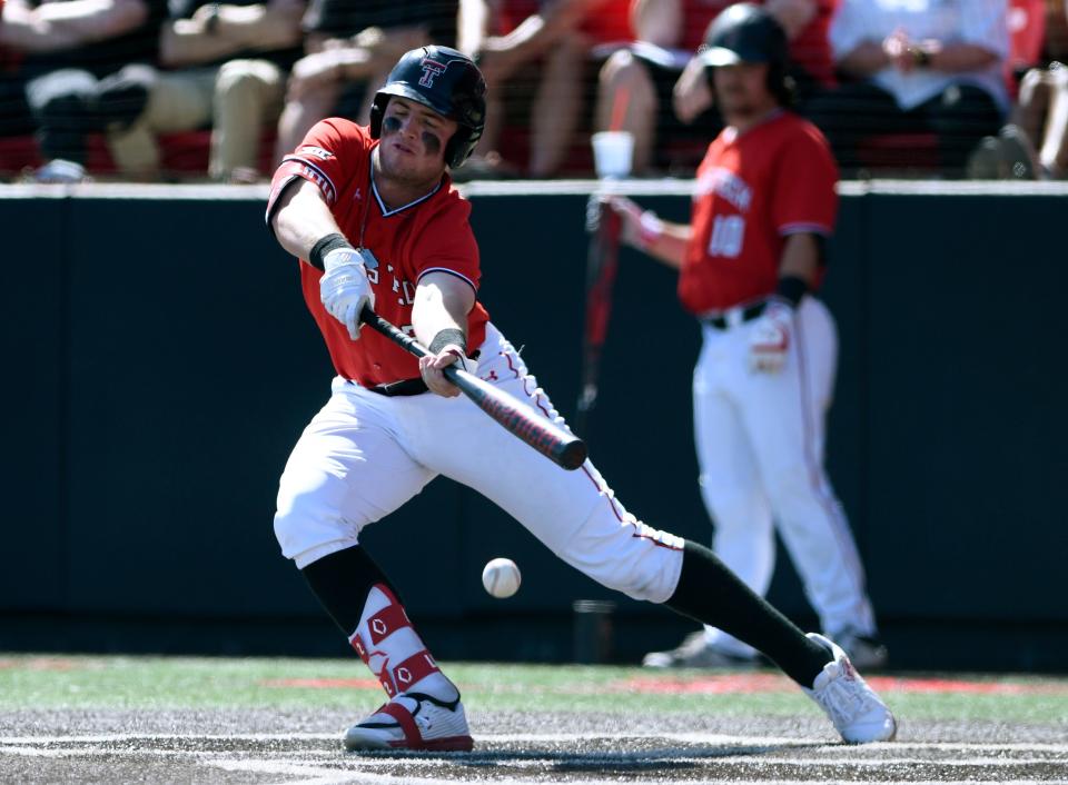 Texas Tech infielder Jace Jung (2) bunts the ball against Texas, Saturday, March 26, 2022, at Dan Law Field at Rip Griffin Park. Texas Tech won, 16-12 in 10 innings.