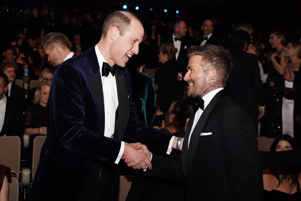 Britain's Prince William, Prince of Wales (L) shakes hands with former footballer David Beckham (R) during the BAFTA British Academy Film Awards at the Royal Festival Hall, Southbank Centrer, in London, on February 18, 2024. (Photo by Jordan Pettitt / POOL / AFP) (Photo by JORDAN PETTITT/POOL/AFP via Getty Images)