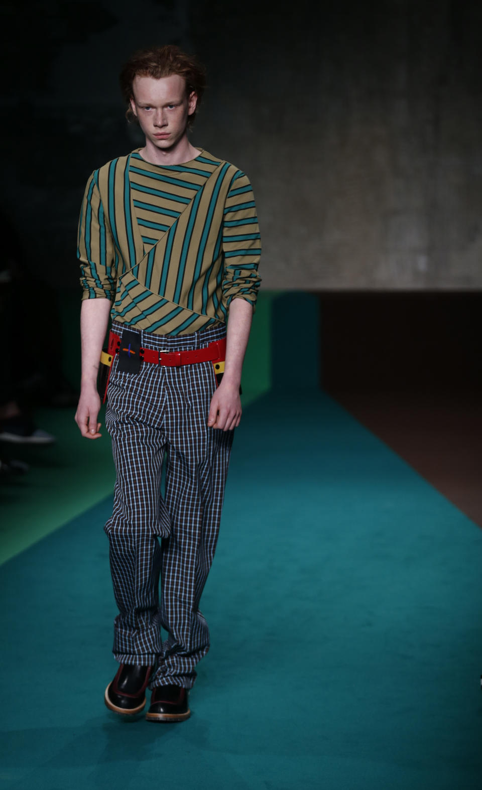 A model wears a creation for the Marni men's Fall-Winter 2017-2018 collection, part of the Milan Fashion Week, unveiled in Milan, Italy, Saturday, Jan. 14, 2017. (AP Photo/Antonio Calanni)