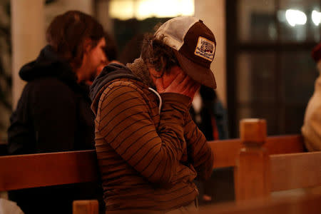 Genevieve Griesau of Oakland weeps during a vigil at the Chapel of the Chimes for victims of a fire in the Fruitvale district of Oakland, California, U.S. December 3, 2016. REUTERS/Stephen Lam