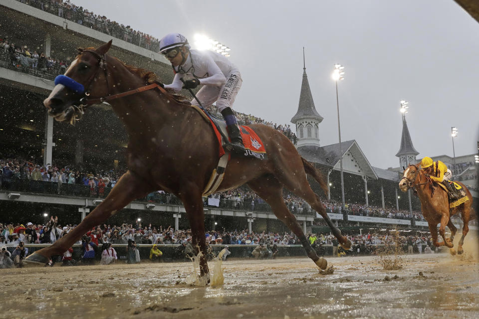 FILE - In this May 5, 2018, file photo, Mike Smith rides Justify to victory during the 144th running of the Kentucky Derby horse race at Churchill Downs in Louisville, Ky. The move of the Triple Crown’s first leg to Labor Day weekend due to the coronavirus pandemic will mark the first time the Derby won’t run on the first Saturday in May since 1945. (AP Photo/Morry Gash, File)