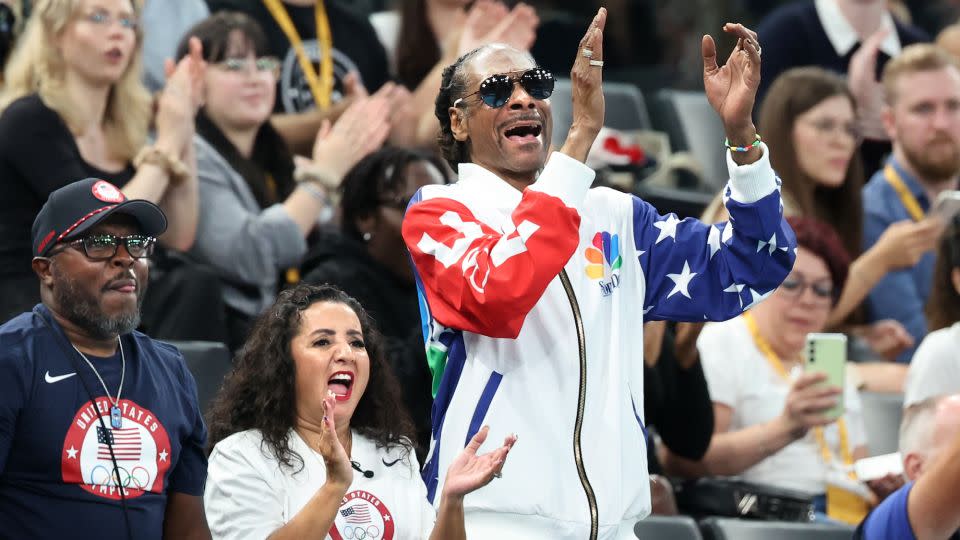 Rapper Snoop Dogg cheers the USA team during qualifying for women's team gymnastics at the 2024 Olympics in Paris, France on Sunday. - Wally Skalij/Los Angeles Times/Getty Images