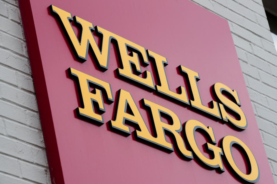 FILE – This Aug. 11, 2017, file photo shows a sign at a Wells Fargo bank location in Philadelphia. The New York Times and other news outlets are reporting Thursday, April 19, 2018, that federal regulators plan to fine Wells Fargo as much as $1 billion as early as Friday for abuses tied to its auto lending and mortgage businesses. (AP Photo/Matt Rourke, File)