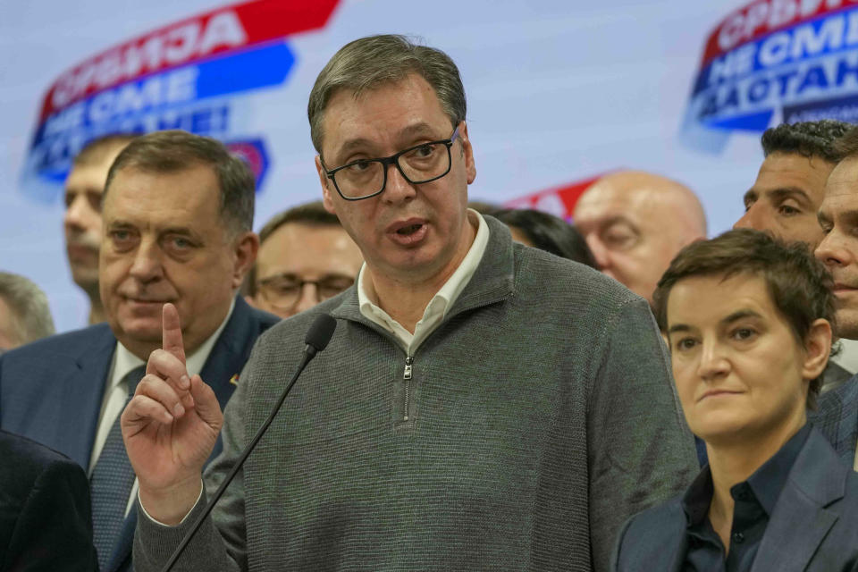 Serbian President Aleksandar Vucic speaks to the media in his party headquarters after a parliamentary and local election in Belgrade, Serbia, Sunday, Dec. 17, 2023. Serbia's governing populists claimed a sweeping victory Sunday in the country's parliamentary election, which was marred by reports of major irregularities both during a tense campaign and on voting day. (AP Photo/Darko Vojinovic)