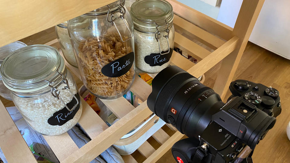 A set up showing the camera taking photographs of pasta in jars