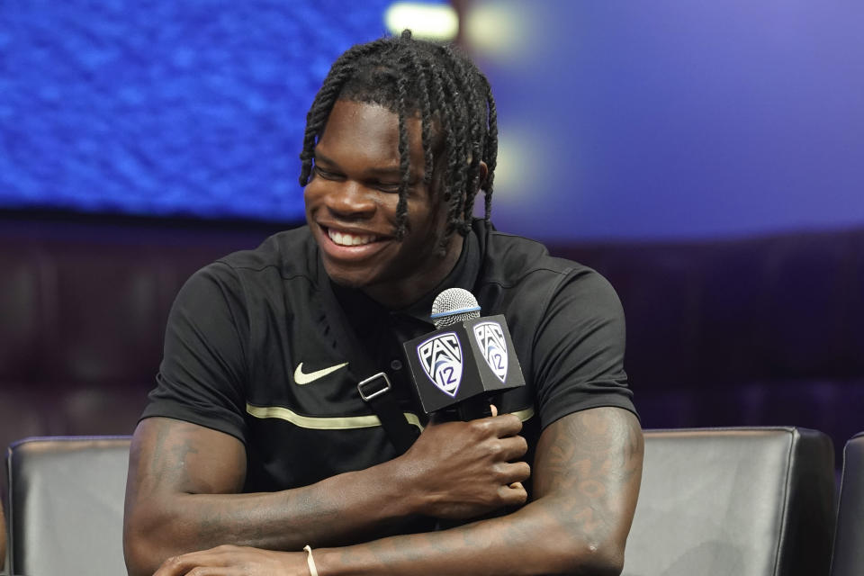 Colorado cornerback/wide receiver Travis Hunter laughs at an NCAA college football Pac-12 media day Friday, July 21, 2023, in Las Vegas. (AP Photo/Lucas Peltier)