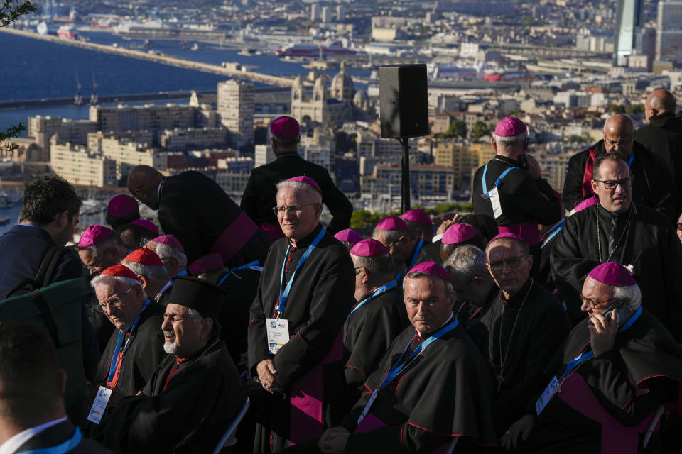 Cardinals and bishops wait outside the Notre Dame de la Garde Basilica for the arrival of Pope Francis to take part in a Marian prayer with the diocesan clergy, in Marseille,France, Friday, Sept. 22, 2023. Francis, during a two-day visit, will join Catholic bishops from the Mediterranean region on discussions that will largely focus on migration. (AP Photo/Pavel Golovkin)