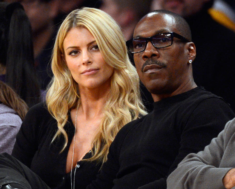<p>Paige Butcher and Eddie Murphy attend the Lakers and Suns game at Staples Center in 2012. </p>
