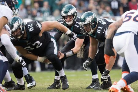 Nov 5, 2017; Philadelphia, PA, USA; Philadelphia Eagles quarterback Carson Wentz (11) takes a snap from center Jason Kelce (62) in front of defensive end Aziz Shittu (61) during the third quarter against the Denver Broncos at Lincoln Financial Field. Bill Streicher-USA TODAY Sports