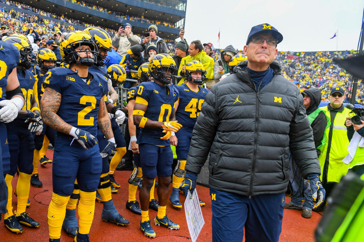 Michigan coach Jim Harbaugh and his team look on prior to a game against the Indiana Hoosiers on Oct. 14. (Aaron J. Thornton/Getty Images)