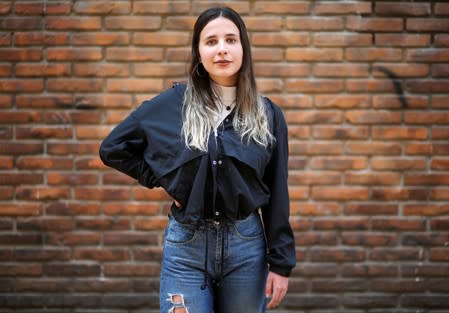 Pilar, 16, who voted for the first time in the primary elections, poses in Buenos Aires