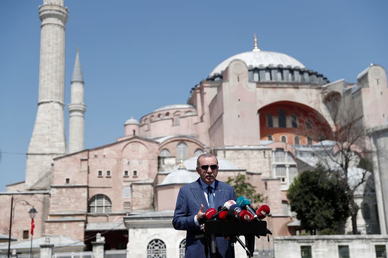 Turkish President Tayyip Erdogan talks to media after attending Friday prayers at Hagia Sophia Grand Mosque in Istanbul