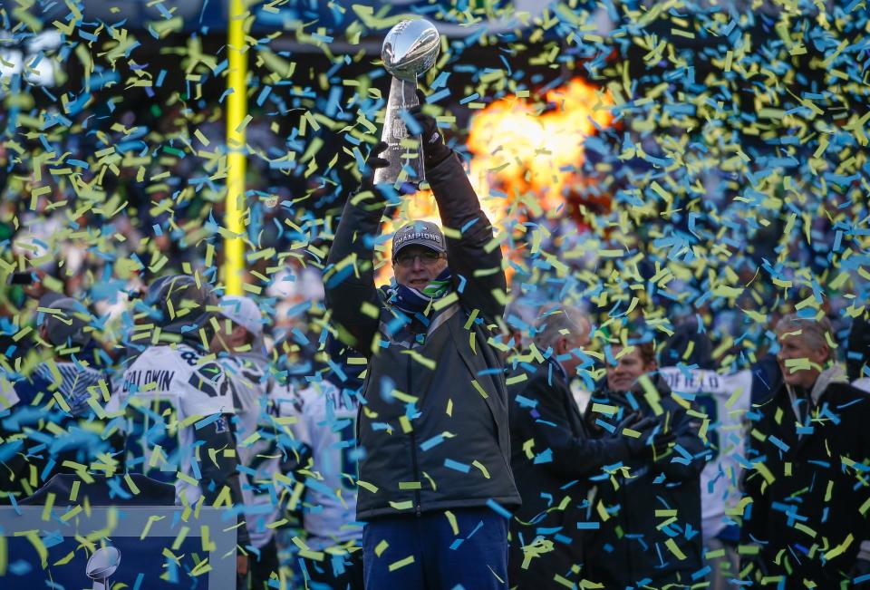 Team Owner Paul Allen of the Seattle Seahawks holds the Lombardi Trophy during ceremonies following the Super Bowl XLVIII Victory Parade at CenturyLink Field on February 5, 2014: Otto Greule Jr/Getty Images
