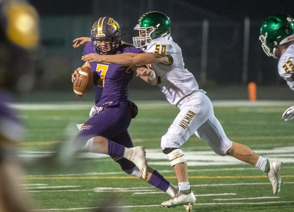 Escalon QB Donovan Rozevink, left, is sacked by Hilmar's Nicholas Vitorino during the Sac Joaquin Section Division V championship game at St. Mary's High School in Stockton. 