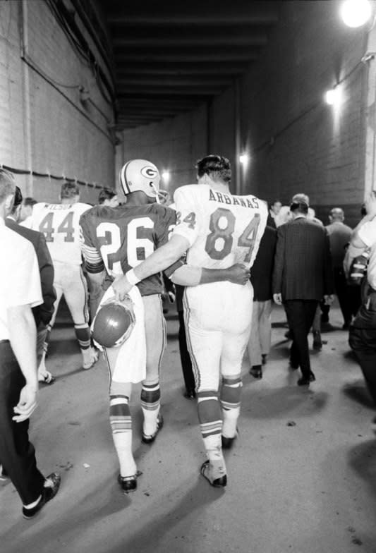 Not originally published in LIFE. The Packers' Herb Adderley and Kansas City's tight end Fred Arbanas head to the lockers after Green Bay's 35-10 victory in Super Bowl I, Los Angeles, 1967. (Bill Ray—Time & Life Pictures/Getty Images) <br> <br> <a href="http://life.time.com/culture/super-bowl-rare-photos-from-the-first-championship-game-in-1967/#1" rel="nofollow noopener" target="_blank" data-ylk="slk:Click here to see the full collection at LIFE.com;elm:context_link;itc:0;sec:content-canvas" class="link ">Click here to see the full collection at LIFE.com</a>