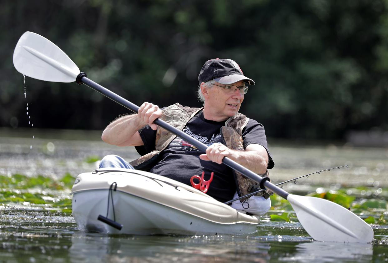 Rick Gust of Appleton kayaks on the Fox River near Sunset Park in Kimberly.