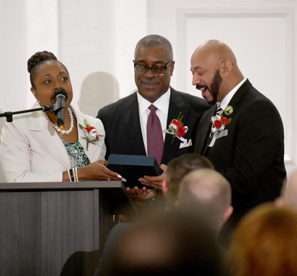 Krista Allison and Rev. Walter Arrington give Thomas West the 2023 MKL Spirit Award during Thursday's Greater Canton Martin Luther King Jr. Commission's 30th annual Mayors' Breakfast,