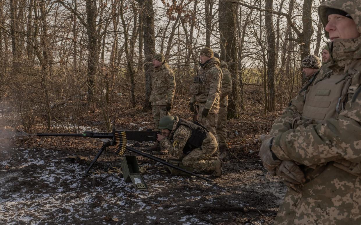 A Ukrainian serviceman of the 22nd Mechanized Brigade shoots with M2 Browning during a military training in the Donetsk region