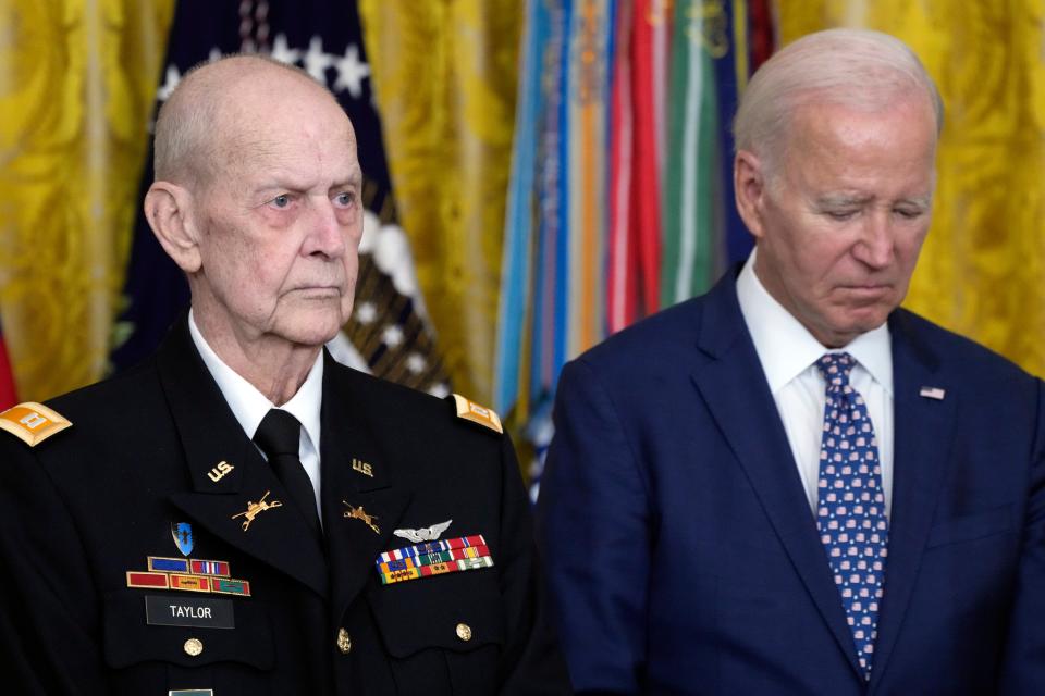 President Joe Biden listens to the citation being read before he awards the Medal of Honor to Capt. Larry Taylor, an Army pilot from the Vietnam War who risked his life to rescue a reconnaissance team that was about to be overrun by the enemy, during a ceremony Tuesday, Sept. 5, 2023, in the East Room of the White House in Washington. (AP Photo/Jacquelyn Martin)