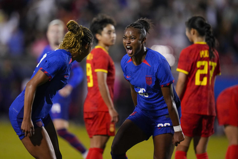 United States' Jaedyn Shaw, center right, reacts with Midge Purce after scoring a goal against China during the second half of a women's international friendly soccer match, Tuesday, Dec. 5, 2023, in Frisco, Texas. (AP Photo/Julio Cortez)