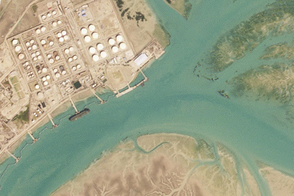 In this satellite photo by Planet Labs PBC, an oil tanker that the group United Against Nuclear Iran believes is the Abyss is docked at Bandar Mashahr, Iran, Feb. 22, 2023. The Oceania, owned by a major U.S.-traded transportation company, appears to be taking on Iranian crude oil from the Abyss in a key Asian maritime strait in violation of American sanctions, the advocacy group alleges. The firm allegedly involved, Euronav, said Wednesday, March 29, 2023, it will "take appropriate action when necessary." (Planet Labs PBC via AP)