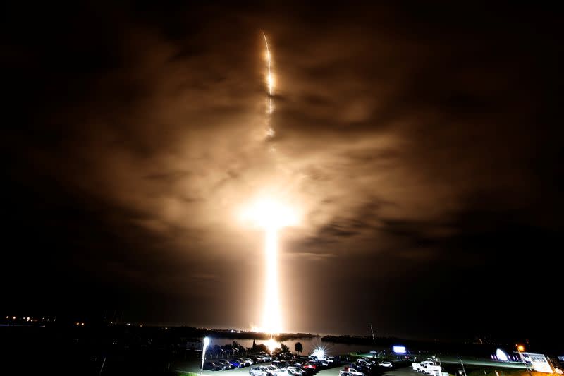 FILE PHOTO: SpaceX Falcon 9 rocket, with the Crew Dragon capsule, is launched carrying four astronauts on a mission to the International Space Station