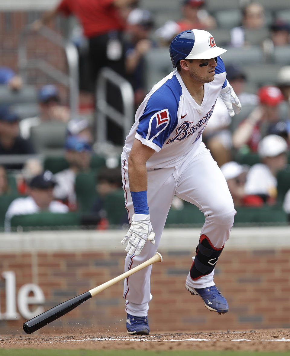 Atlanta Braves' Austin Riley drops his bat after hitting an RBI single against the Milwaukee Brewers in the sixth inning of a baseball game, Sunday, Aug. 1, 2021, in Atlanta. (AP Photo/Ben Margot)