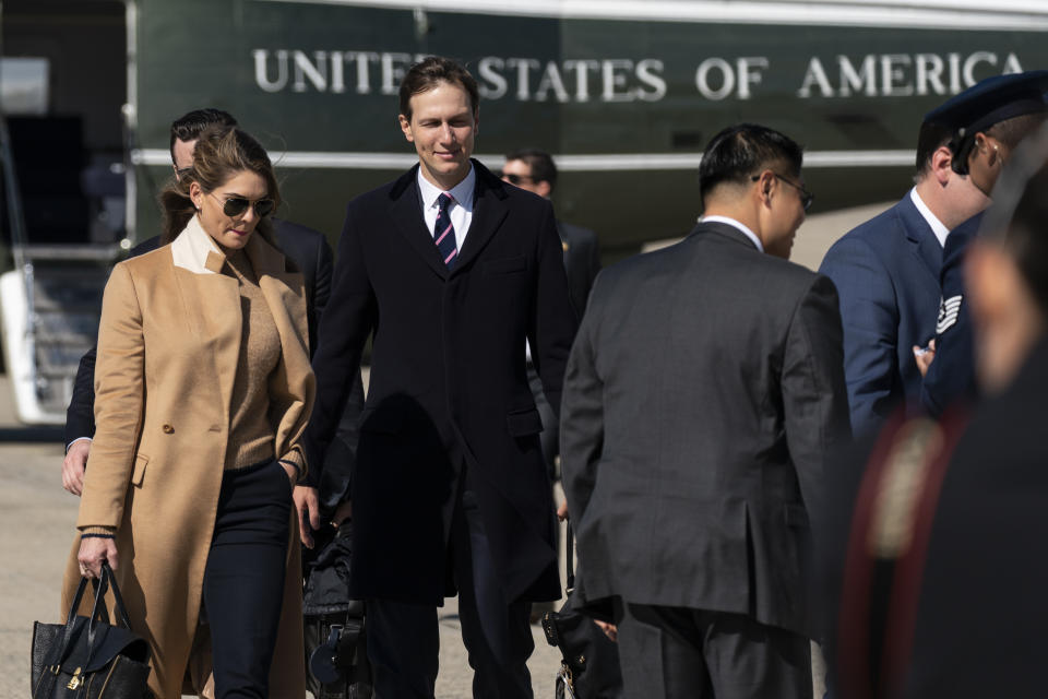 Counselor to the President Hope Hicks, left, with White House senior adviser Jared Kushner, walk from Marine One to accompany President Donald Trump aboard Air Force One as he departs Wednesday, Sept. 30, 2020, at Andrews Air Force Base, Md. (AP Photo/Alex Brandon)