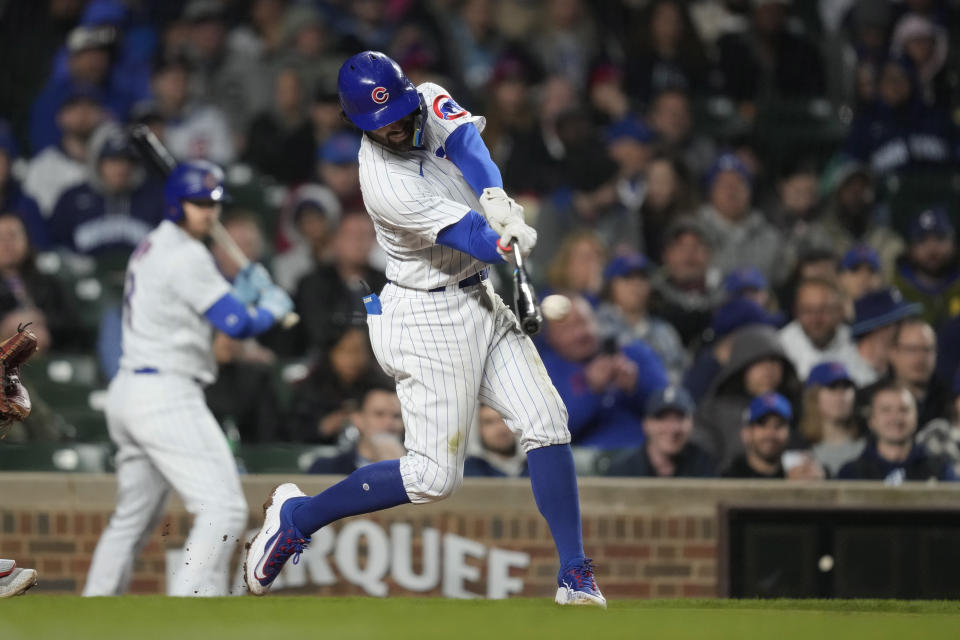 Chicago Cubs' Dansby Swanson hits an RBI double off St. Louis Cardinals relief pitcher Genesis Cabrera during the fifth inning of a baseball game on Monday, May 8, 2023, in Chicago. (AP Photo/Charles Rex Arbogast)