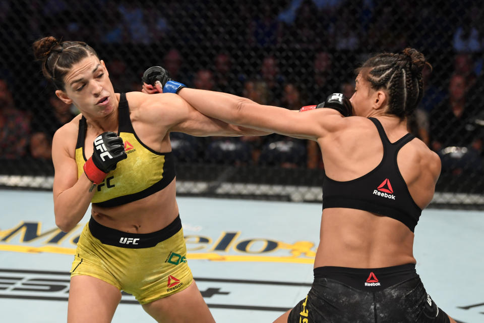 TAMPA, FLORIDA - OCTOBER 12: (L-R) Mackenzie Dern punches Amanda Ribas of Brazil in their women's strawweight bout during the UFC Fight Night event at Amalie Arena on October 12, 2019 in Tampa, Florida. (Photo by Josh Hedges/Zuffa LLC via Getty Images)