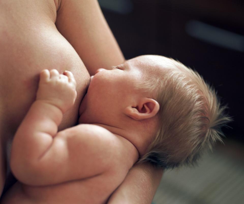 An image of a mother breastfeeding her baby.