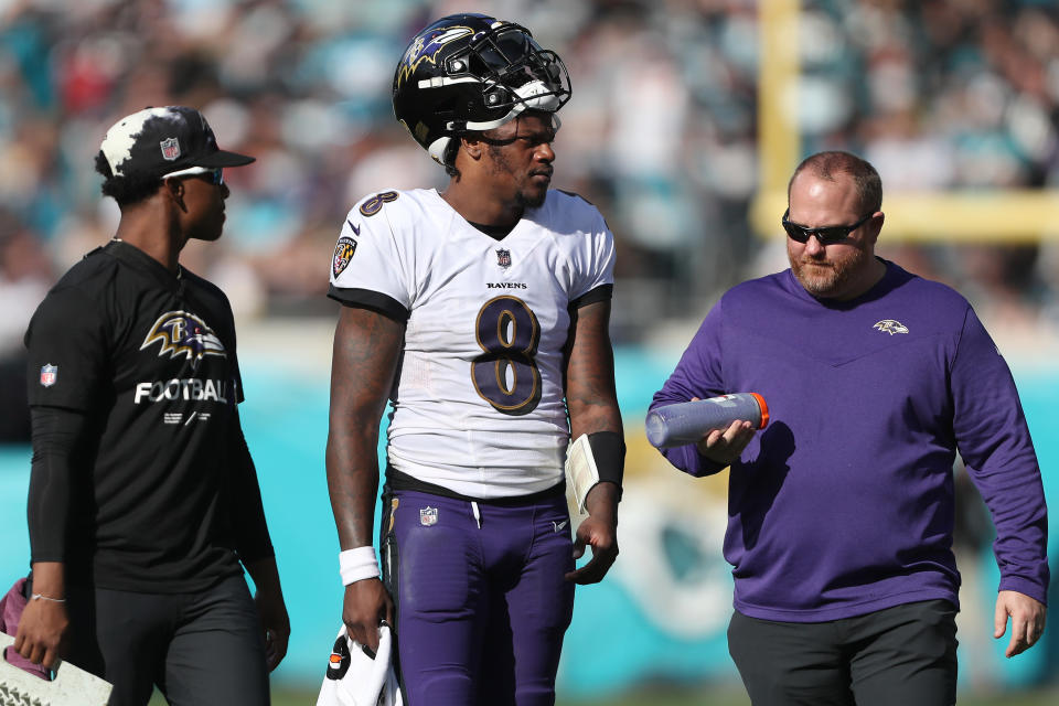 Lamar Jackson's hopes of landing a fully guaranteed contract took another hit on Monday when Jalen Hurts agreed on a partially guaranteed contract. (Courtney Culbreath/Getty Images)